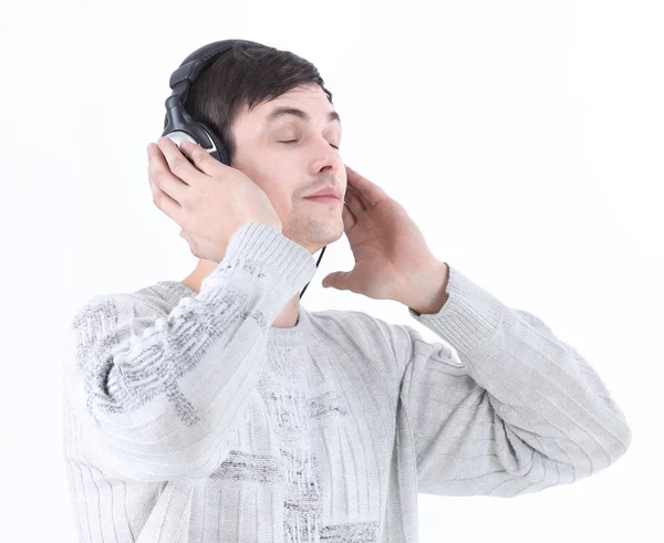 Close seup.modern boy listening to music through headphones . — стоковое фото