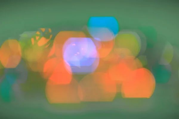 Festivo background.blurred luci colorate su uno sfondo nero — Foto Stock