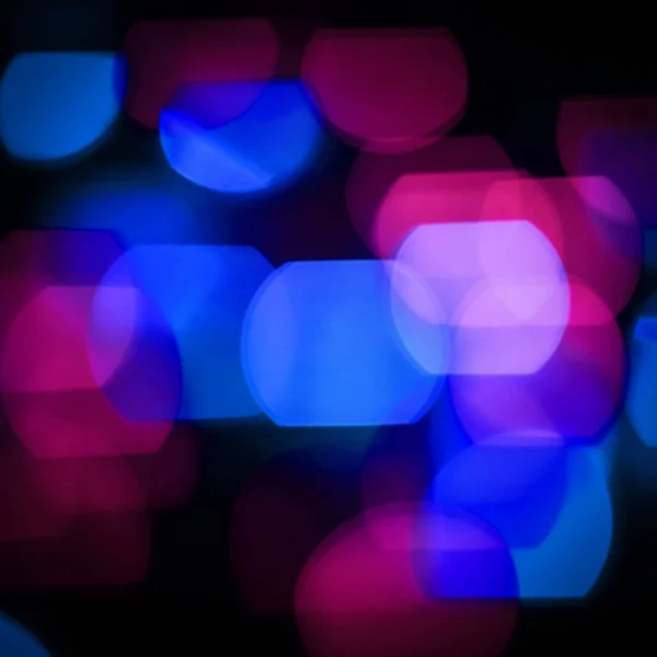 Festivo background.blurred luci colorate su uno sfondo nero — Foto Stock