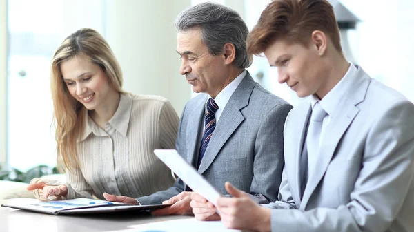Smiling business team checking financial data.photo with copy space — Stock Photo, Image
