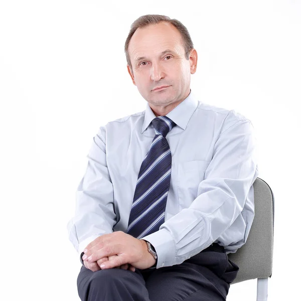 Serious businessman sitting in an office chair. isolated on a white — Stock Photo, Image