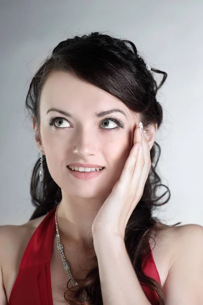 Closeup. portrait of a beautiful woman in a red dress. Stock Picture