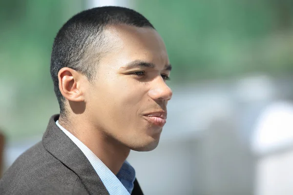 Closeup.confident young businessman on background of office — Stock Photo, Image