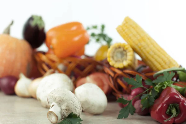 Mushrooms on a background of fresh vegetables. — Stock Photo, Image