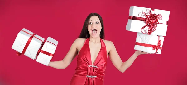 Happy pretty woman holding many boxes with presents. — Stock Photo, Image