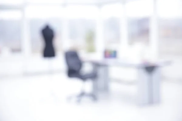 blurred image of the fashion office . individual tailoring