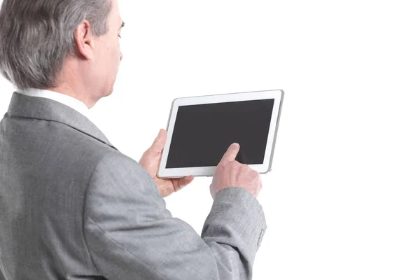 Close up.the businessman aponta para o tablet screen.rear view.isolated no fundo branco — Fotografia de Stock