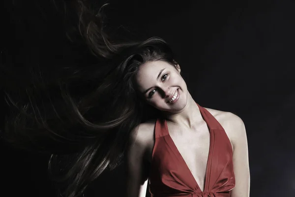 Portrait of fashionable young woman in a red dress . isolated o — Stock Photo, Image