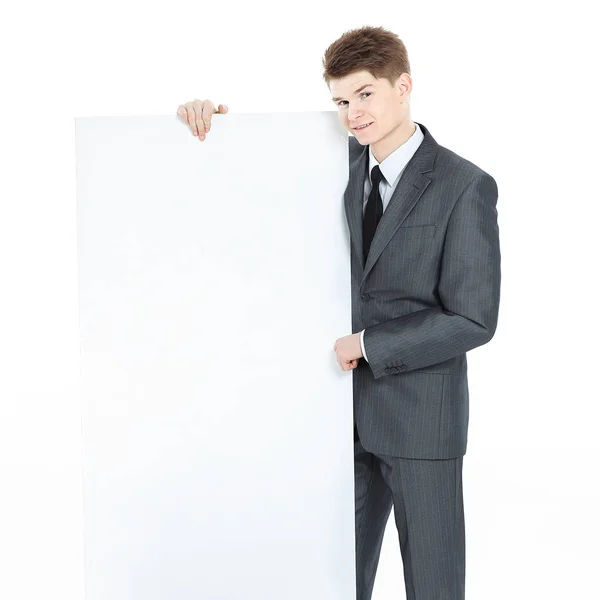 Udany młody biznesmen, patrząc na pusty transparent — Zdjęcie stockowe