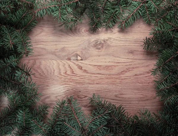 Traditional green Christmas wreath on wooden background — Stock Photo, Image