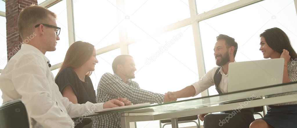 handshake business people over the Desk in the office