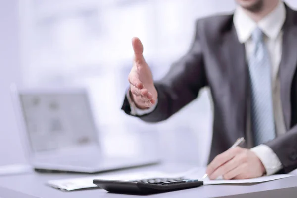 Close-up image of the hand of a business man in a dark suit greeting somebody — Stock Photo, Image