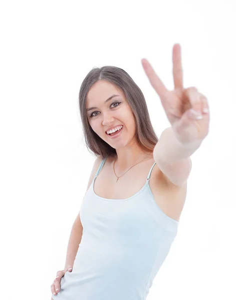 Mujer joven moderna mostrando signo de victoria. aislado sobre un fondo blanco . —  Fotos de Stock