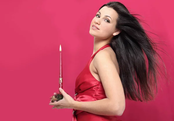 Closeup . a young woman with a Christmas candle — Stock Photo, Image