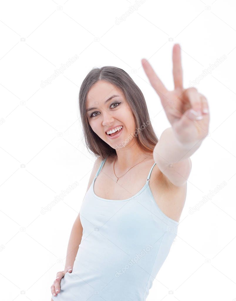 modern young woman showing victory sign. isolated on a white background.