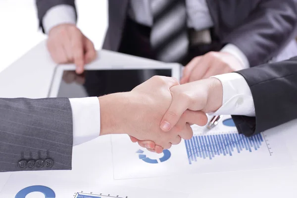 Close up.the financial partners shaking hands over a Desk — Stock Photo, Image