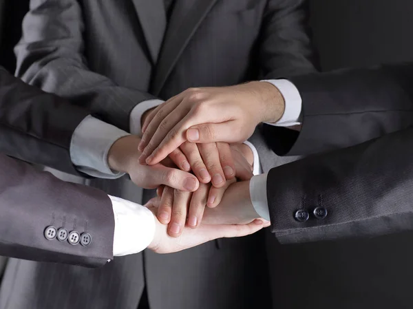 Group of business people folded their hands together — Stock Photo, Image