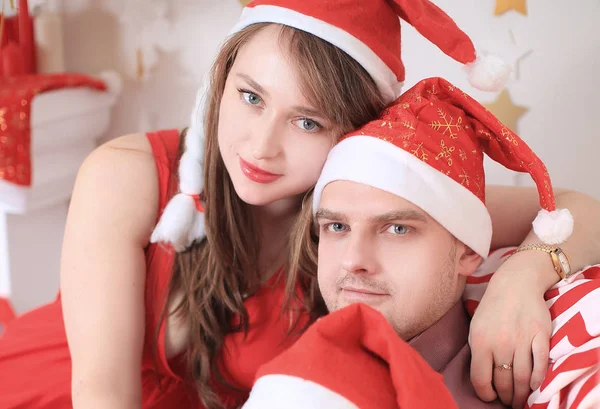 Close up.married couple in Santa Claus costumes Stock Photo