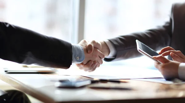 Close up. the financial partners shaking hands over a Desk — Stock Photo, Image