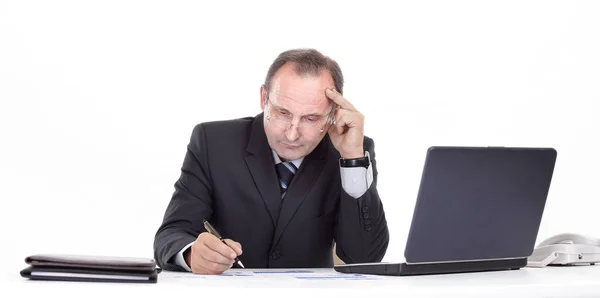 Close up. thoughtful businessman in the workplace — Stock Photo, Image