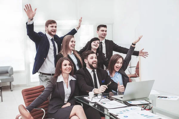 Business team with their hands up and voting for decision-making near the desktop — Stock Photo, Image