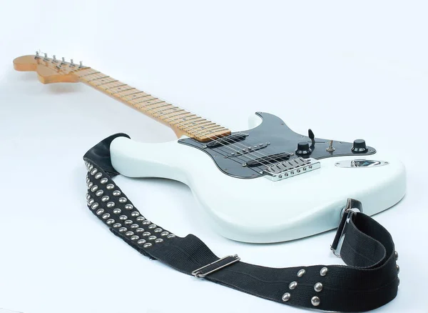 closeup.electric guitar with metal strap. isolated on white.