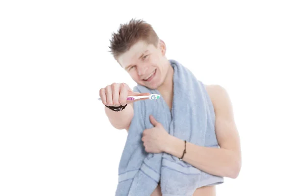 Young man with towel and toothbrush.isolated on white Stock Image