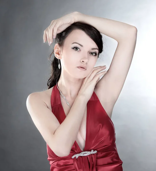 Portrait of fashionable young woman in a red dress. — Stock Photo, Image