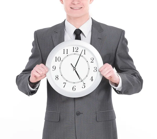 Handsome businessman holding a large clock.isolated on a white — Stock Photo, Image