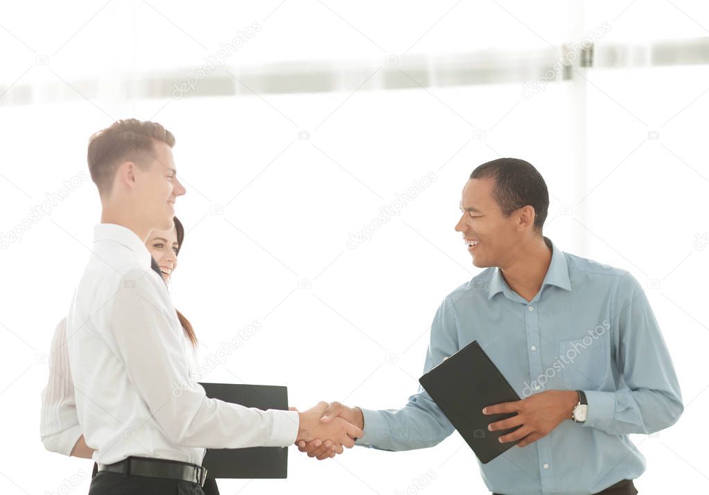 handshake of business people standing in office