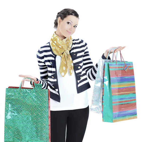 Retrato de una joven adulta feliz, con bolsos codificados por colores. sobre un fondo blanco . —  Fotos de Stock
