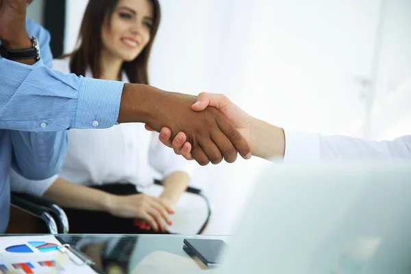 Closeup.the financial partners shaking hands over a Desk. — Stock Photo, Image