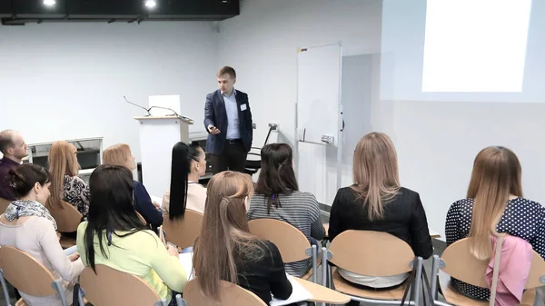 Manager makes a presentation to his business team