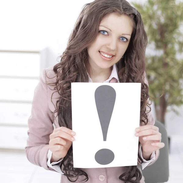 Business woman with an exclamation point in the office. — Stock Photo, Image