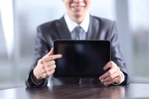 Close up.handsome businessman pointing at digital tablet screen — Stock Photo, Image