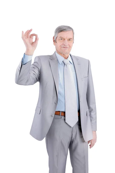 Closeup.handsome senior businessman showing OK gesture. isolated on white. — Stock Photo, Image