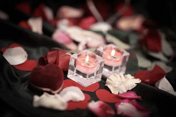 Two candles and a ring on a festive background — Stock Photo, Image