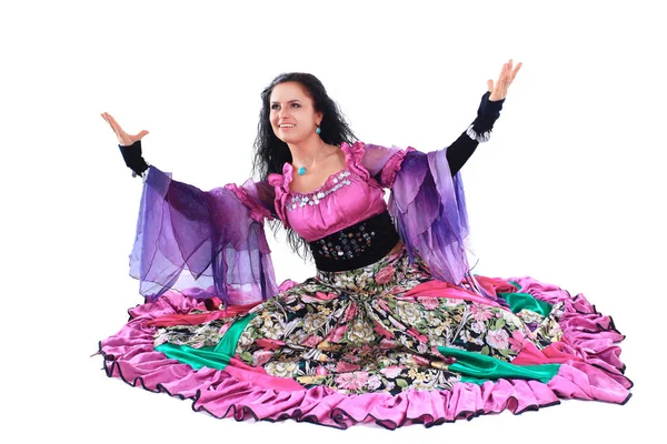 Young beautiful brunette dances a Gypsy dance.isolated on white — Stock Photo, Image