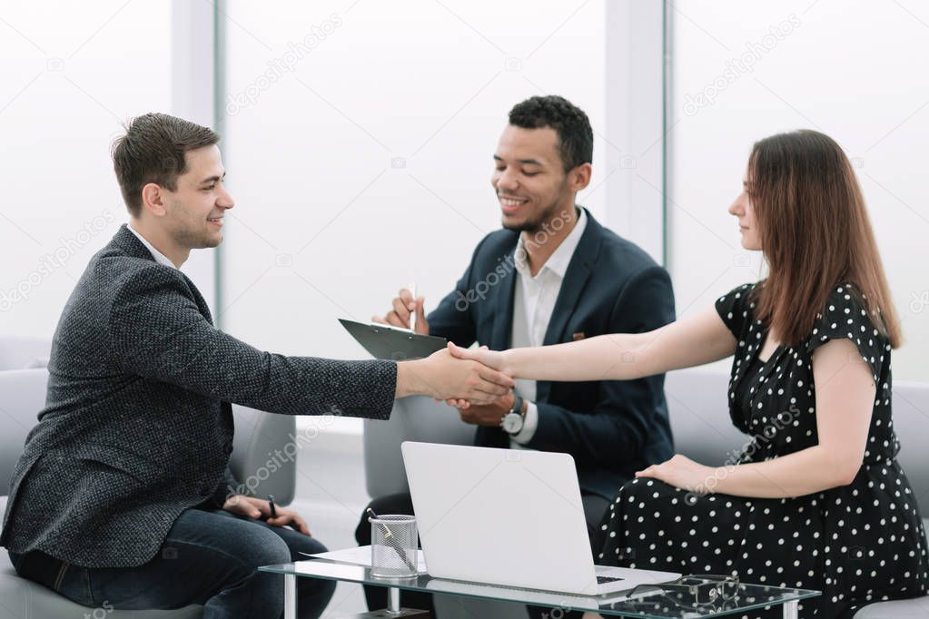 confident handshake of business partners at a business meeting