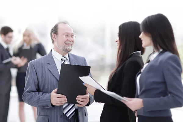 Close up .group of business people standing in lobby of office . — стоковое фото