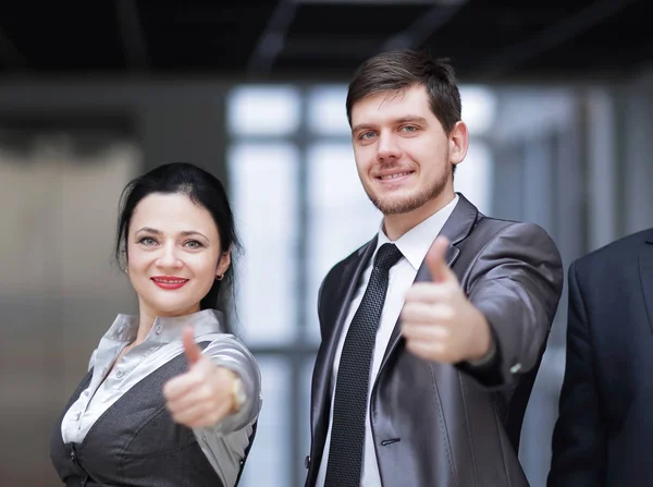Close up.successful business team showing thumb up — Stock Photo, Image