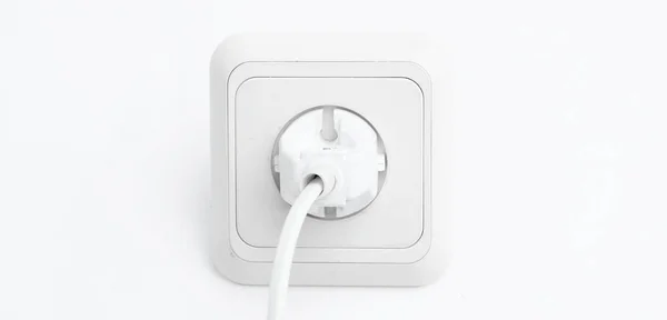 Plug into an electrical outlet.isolated on a white background. — Stock Photo, Image