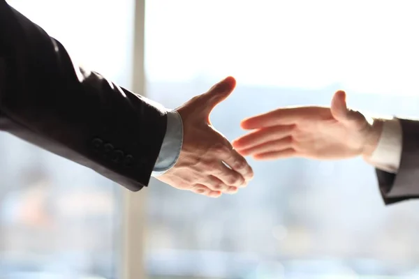 Close up. businessman stretching out his hands to each other for a handshake — Stock Photo, Image