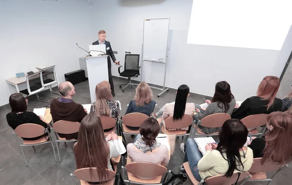 Rear view.the project Manager conducts a meeting — Stock Photo, Image