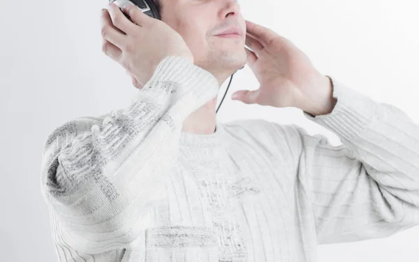 Close seup.modern boy listening to music through headphones . — стоковое фото