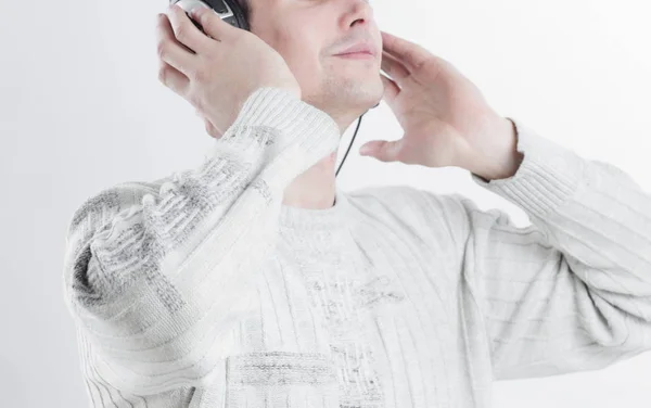 Closeup.modern niño escuchando música a través de auriculares . — Foto de Stock