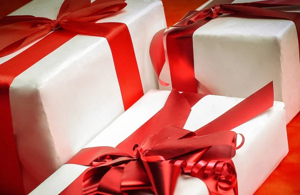 Closeup. two elegant gift boxes.isolated on red — Stock Photo, Image