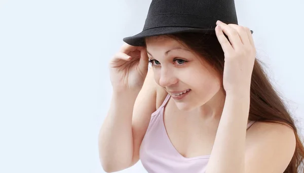 Smiling young woman in black hat.isolated on a white — Stock Photo, Image