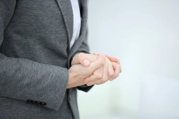 Close up.thoughtful businessman folded his hands in front of him — Stock Photo, Image