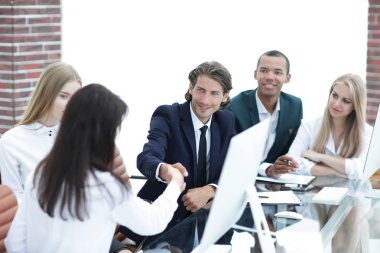 handshake business women with business partner at the negotiating table clipart